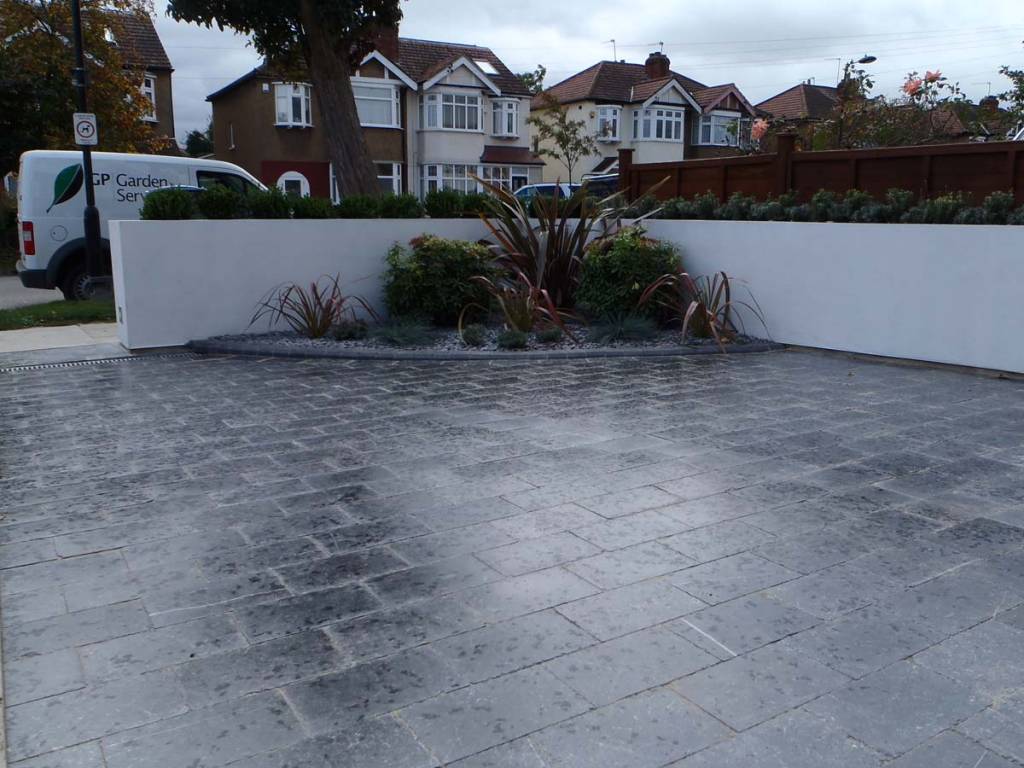 Natural-Stone-Blockwork-Drive-rendered-planter-and-GP-van.jpg